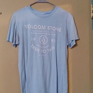 Light blue shirt with white letters